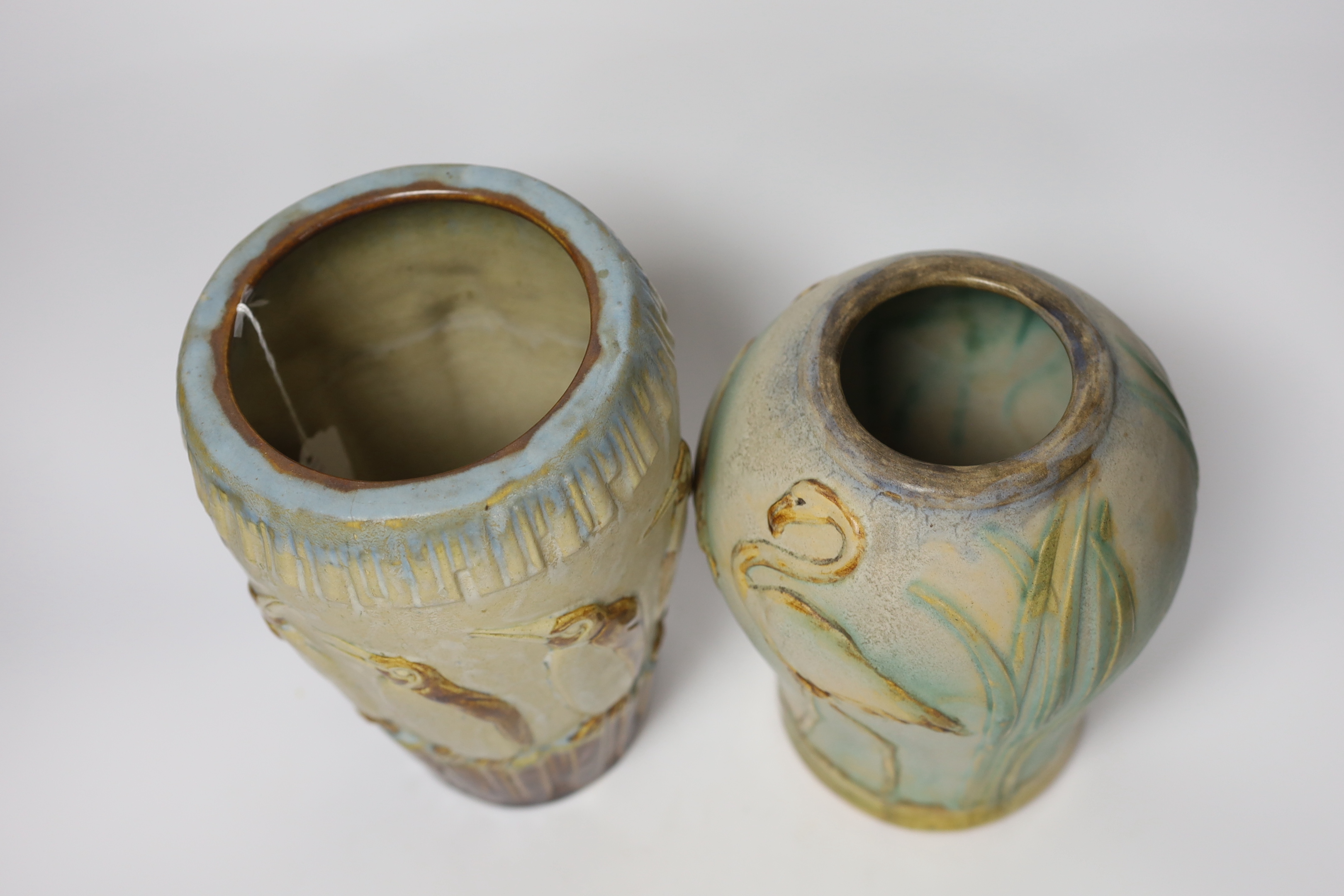 Two Denby ware pottery vases decorated in relief with penguins and flamingos, largest 26cm high